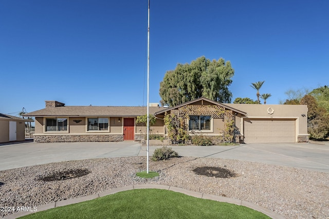 ranch-style home featuring a garage