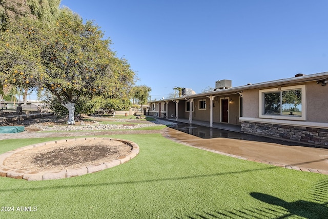 view of yard with a patio and cooling unit