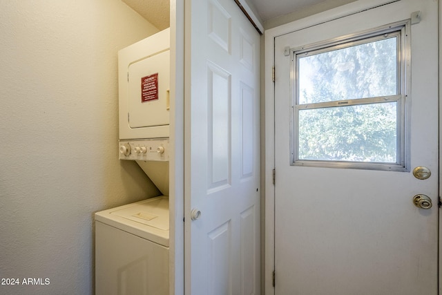 washroom with stacked washer / dryer