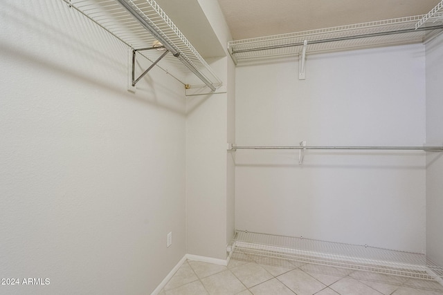 walk in closet featuring light tile patterned floors