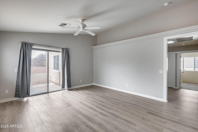 empty room with light wood-type flooring, visible vents, baseboards, and a ceiling fan