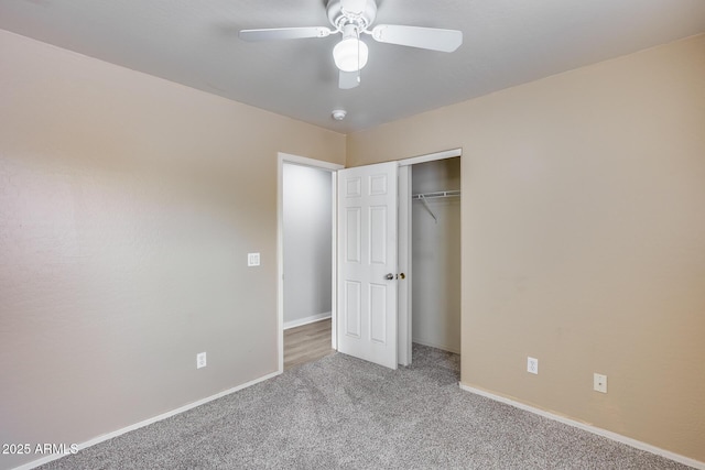 unfurnished bedroom featuring a closet, carpet floors, baseboards, and ceiling fan