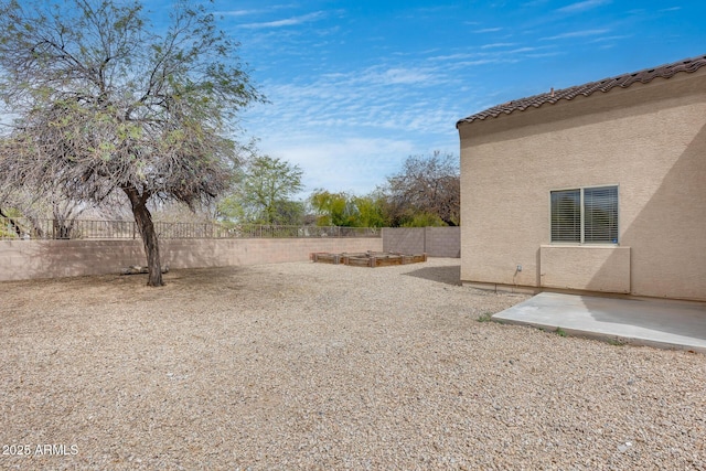 view of yard with a patio and a fenced backyard