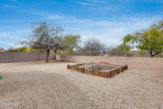 view of yard featuring a garden and fence