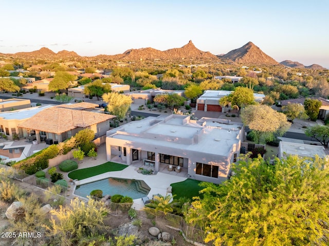 view of subject property with a mountain backdrop