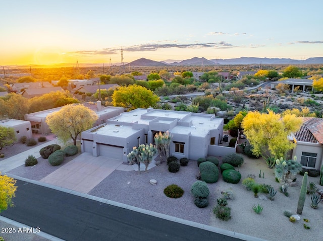 aerial view at dusk of a mountain view and a residential view