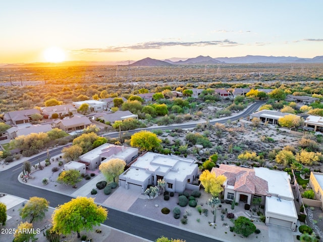 aerial view of residential area featuring a mountainous background
