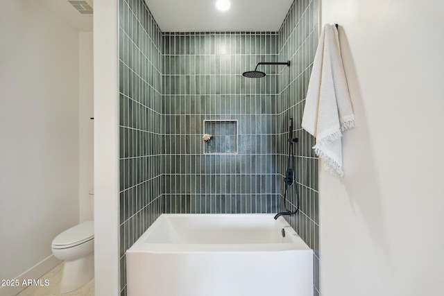 bathroom with toilet, baseboards, and washtub / shower combination