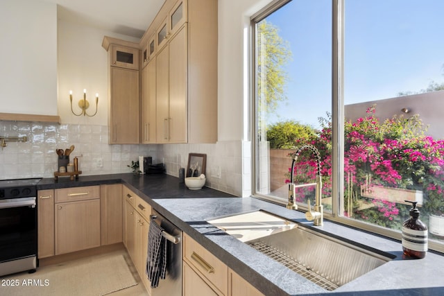 kitchen with electric stove, light brown cabinets, a sink, backsplash, and glass insert cabinets