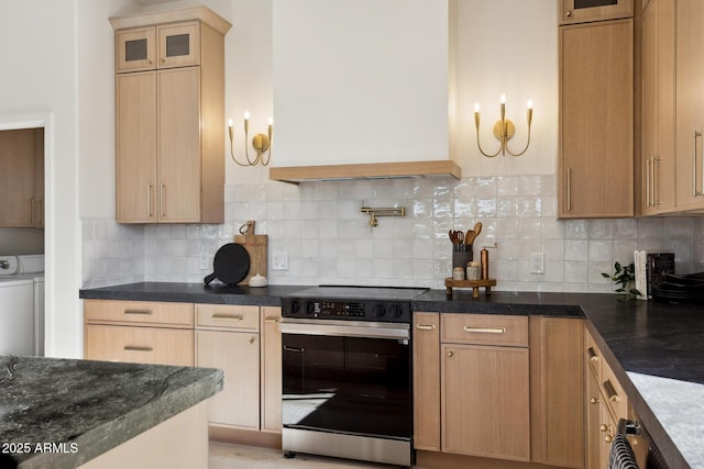 kitchen with electric stove, glass insert cabinets, and backsplash