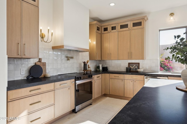 kitchen featuring electric range, custom exhaust hood, light brown cabinetry, and glass insert cabinets