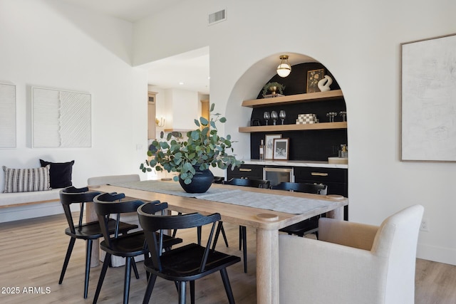 dining space with light wood finished floors