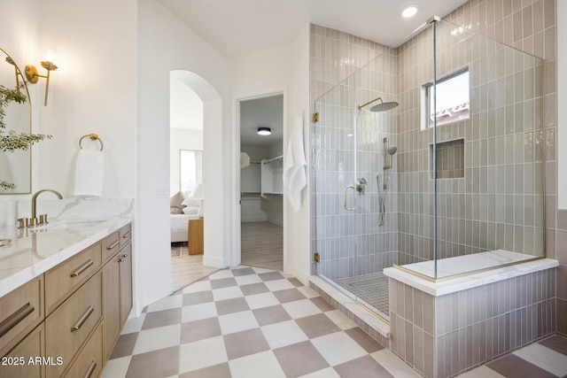 full bath featuring a shower stall, tile patterned floors, vanity, recessed lighting, and baseboards