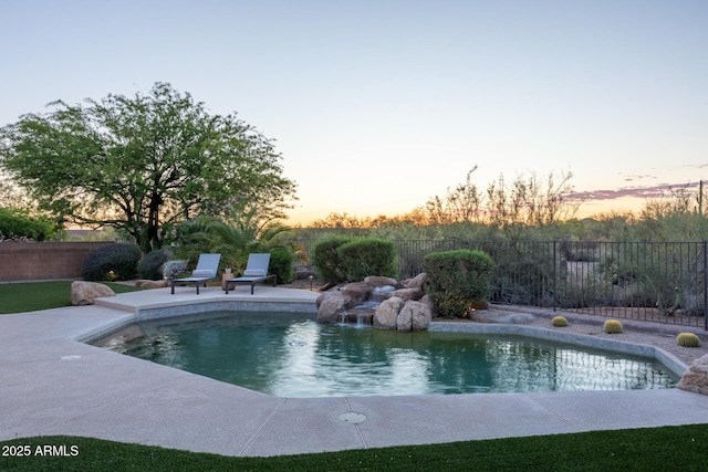 view of swimming pool with a fenced backyard and a patio area
