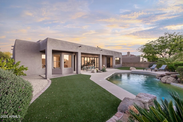 outdoor pool featuring a patio
