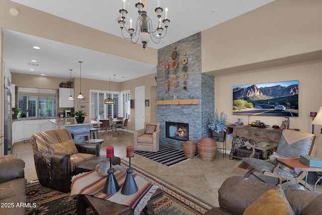 living area featuring light tile patterned floors, a fireplace, a chandelier, and recessed lighting