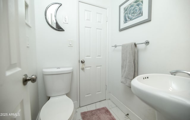 2320 E Mulberry Dr, Phoenix, AZ 85016 - bathroom with baseboards, a sink, and toilet