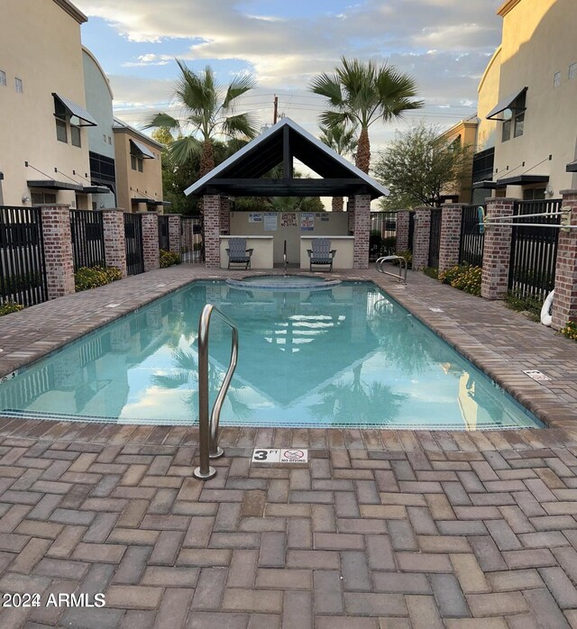 view of swimming pool with a gazebo and a patio