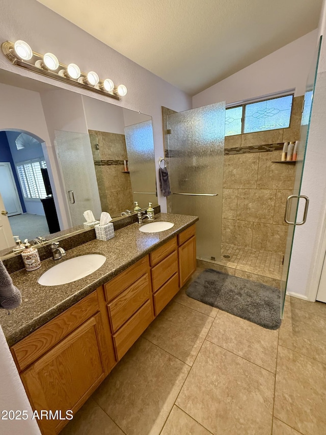 3891 E Simpson Rd, Gilbert, AZ 85297 - bathroom with a shower stall, plenty of natural light, double vanity, and tile patterned floors