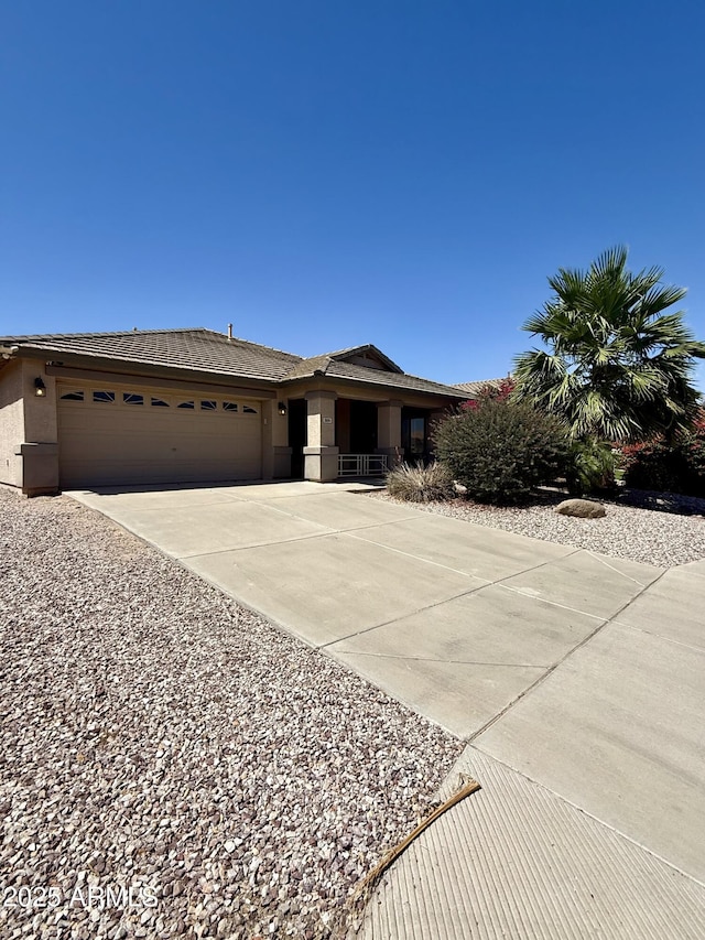 3891 E Simpson Rd, Gilbert, AZ 85297 - view of front facade featuring an attached garage, concrete driveway, and stucco siding
