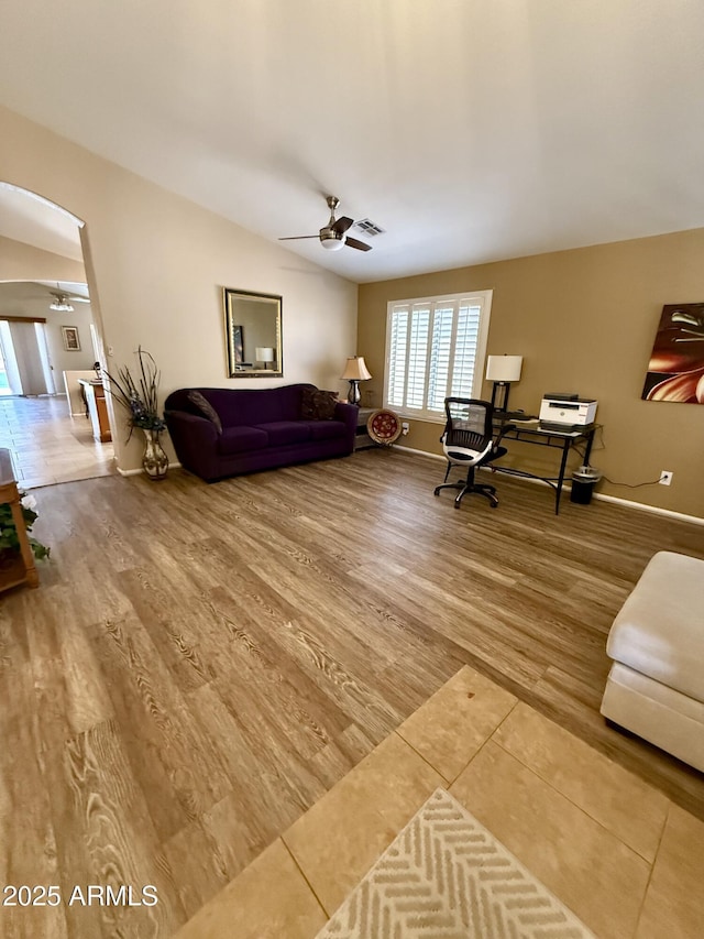 3891 E Simpson Rd, Gilbert, AZ 85297 - living area featuring ceiling fan, arched walkways, and wood finished floors
