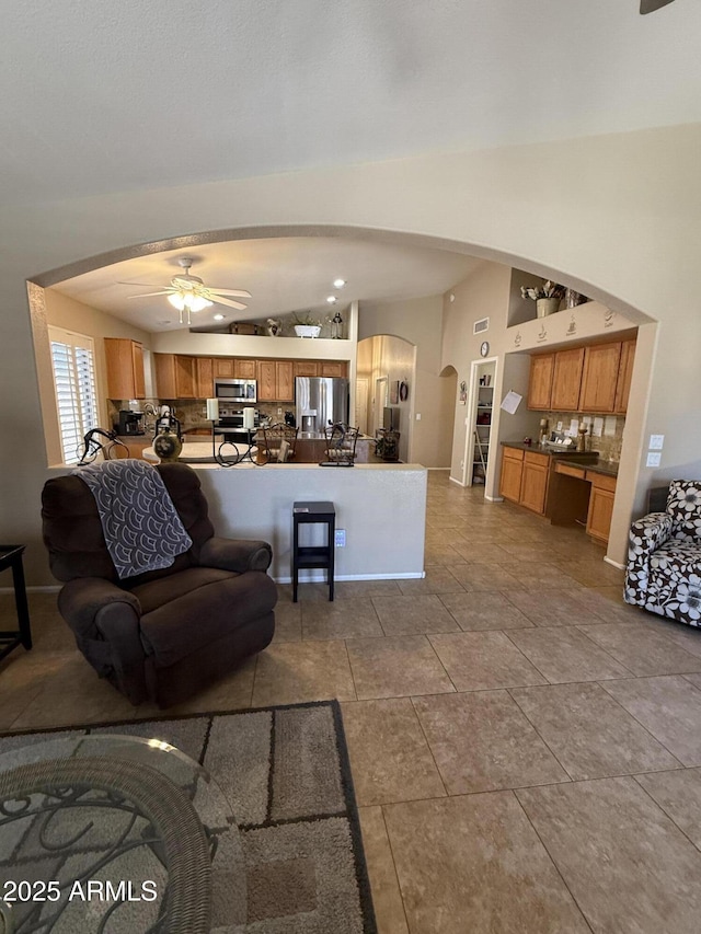 3891 E Simpson Rd, Gilbert, AZ 85297 - living room featuring arched walkways and a ceiling fan