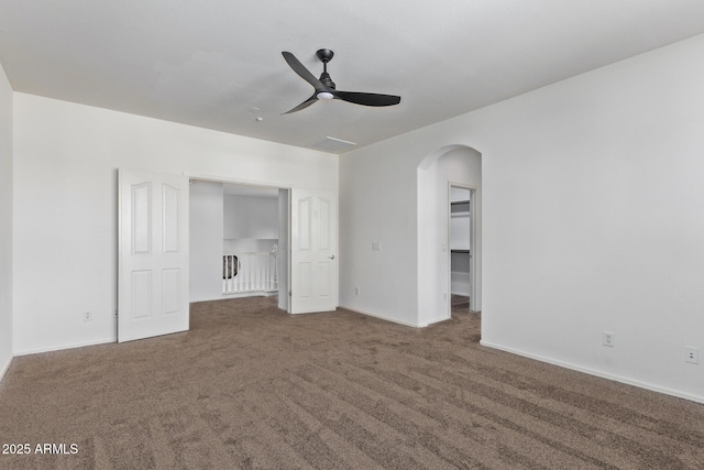 unfurnished bedroom with ceiling fan, carpet floors, and a closet