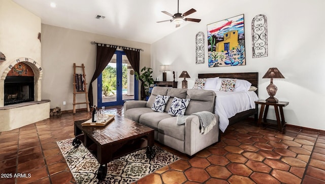 bedroom featuring a ceiling fan, a fireplace, access to outside, baseboards, and visible vents