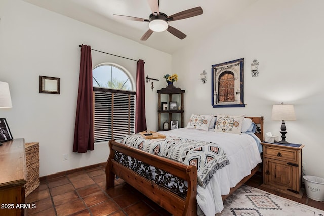 bedroom with baseboards and a ceiling fan
