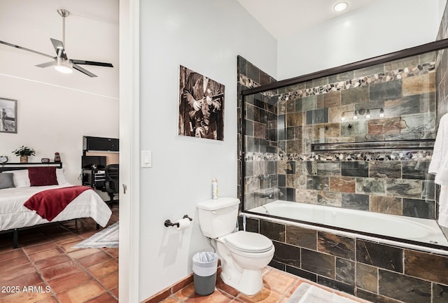 ensuite bathroom with tile patterned floors, toilet, tiled shower / bath combo, a ceiling fan, and ensuite bath