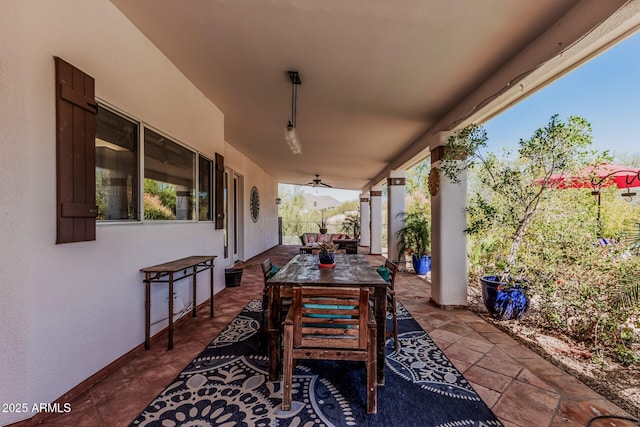 view of patio featuring outdoor dining area