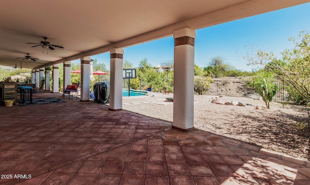 view of patio / terrace featuring a fenced in pool, fence, and a ceiling fan