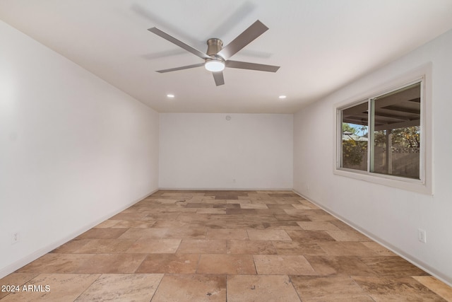 spare room featuring ceiling fan