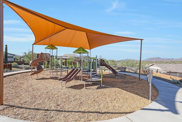 view of playground with a mountain view