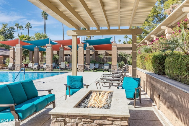 view of patio with an outdoor living space with a fire pit, a pergola, and a community pool