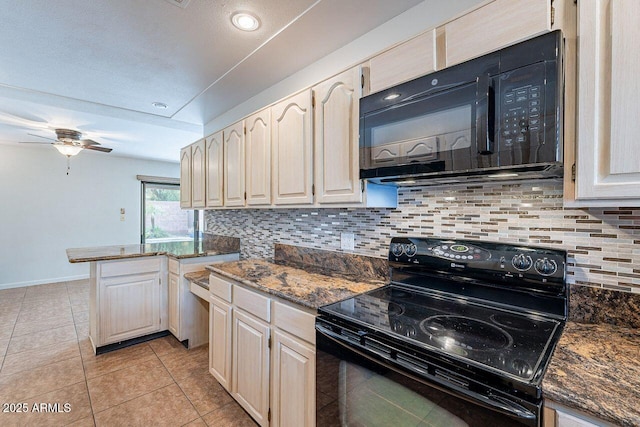 kitchen with baseboards, ceiling fan, light tile patterned floors, decorative backsplash, and black appliances