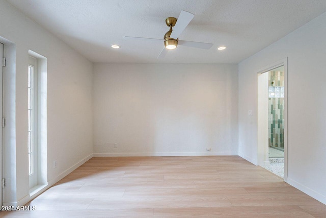 unfurnished room with baseboards, recessed lighting, light wood-style flooring, a textured ceiling, and a ceiling fan