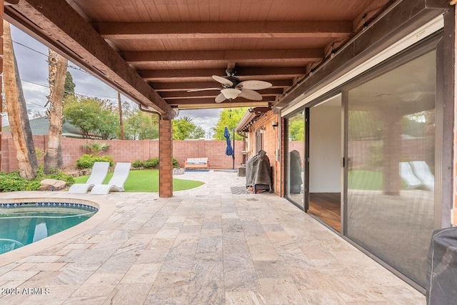 view of patio featuring a ceiling fan, a fenced backyard, and a fenced in pool