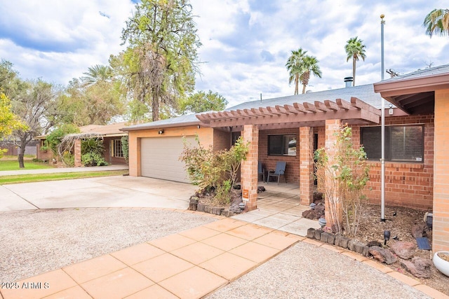 view of front of property featuring brick siding, concrete driveway, and an attached garage