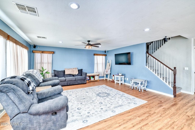 775 E Leslie Ave, San Tan Valley, AZ 85140 - living area with wood finished floors, stairway, a ceiling fan, baseboards, and recessed lighting