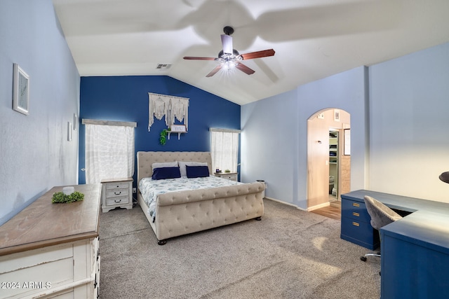 bedroom with carpet floors, vaulted ceiling, and ceiling fan