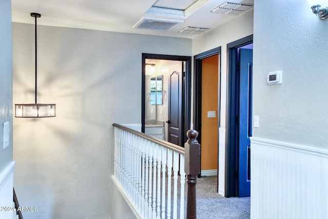 775 E Leslie Ave, San Tan Valley, AZ 85140 - hallway featuring carpet floors and a wainscoted wall