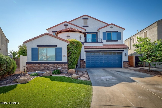 view of front of property with a balcony, a front lawn, and a garage