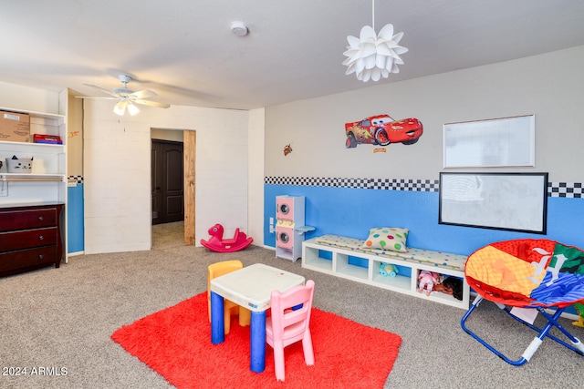 recreation room with carpet and ceiling fan