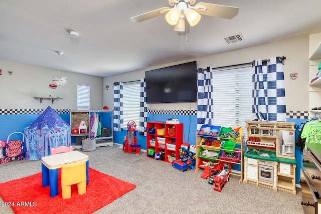 recreation room featuring ceiling fan and carpet