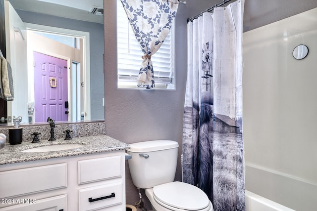 full bathroom featuring vanity, plenty of natural light, shower / bath combo, and toilet