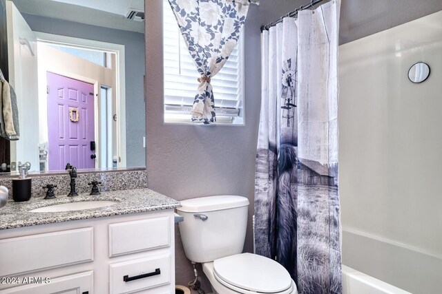 775 E Leslie Ave, San Tan Valley, AZ 85140 - bathroom featuring a textured wall, toilet, vanity, and shower / bath combo