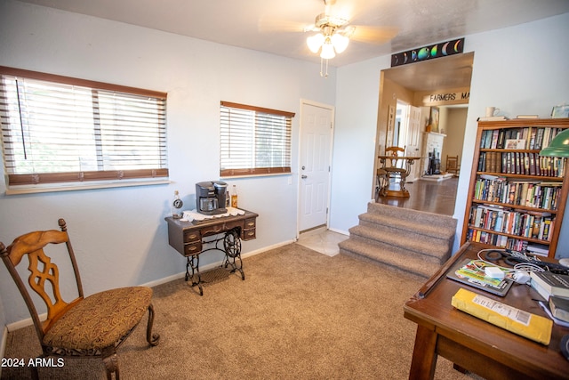 home office with ceiling fan and light colored carpet