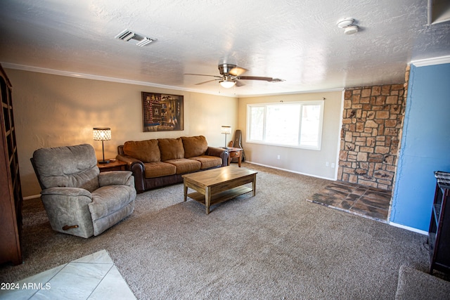 living room with ceiling fan, a textured ceiling, carpet floors, and ornamental molding