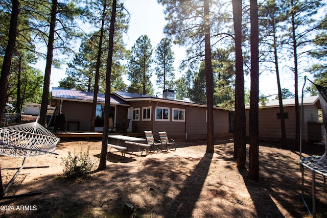 back of house with a patio area